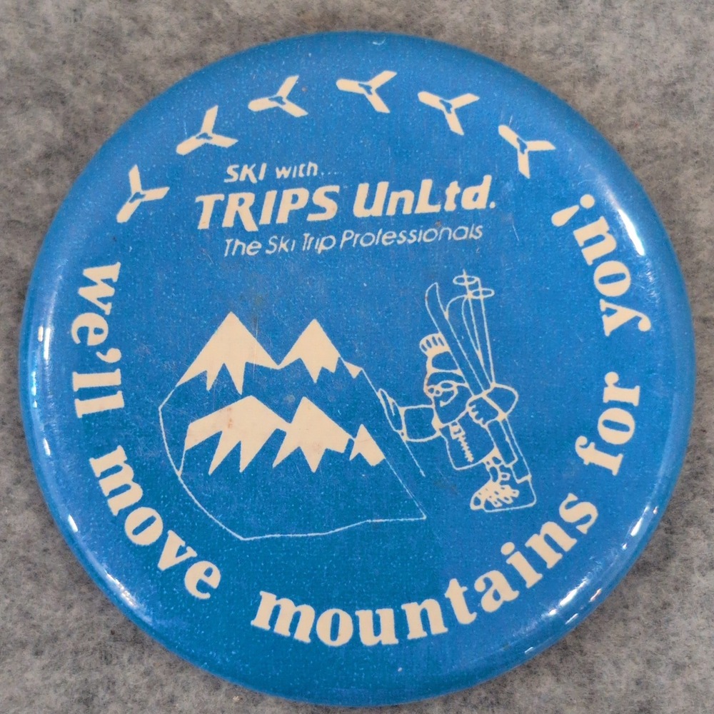 Trips Unltd. Ski The Ski Trip Professionals Vtg Button Pin We'll Move Mountains
